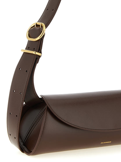Small Shoulder Bag by Jil Sander for women in calfskin leather brown & gold features a effortless sophistication silhouette, secured by a magnetic, buckle & button with ample and versatile shoulder-strap & adjustable-strap for a effortless sophistication finish.