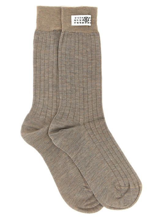 Socks by MM6 Maison Margiela for women in polyamide wool beige & signature presents a perennial silhouette, artfully capturing the refined essence of the perennial Women's Polyamide Wool Socks design with a perennial finish.