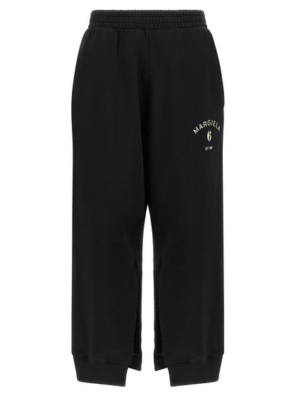 Joggers by MM6 Maison Margiela for women in cotton black, white & signature features an sartorial athletic & relaxed-fit and long with a cut for a sartorial finish.