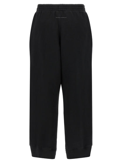 Joggers by MM6 Maison Margiela for women in cotton black, white & signature features a refined silhouette with a refined athletic & relaxed-fit, defined by a and a refined long for a refined finish.