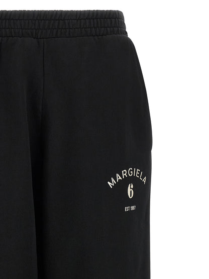 Joggers by MM6 Maison Margiela for women in cotton black, white & signature features an sartorial athletic & relaxed-fit and long with a cut for a sartorial finish.