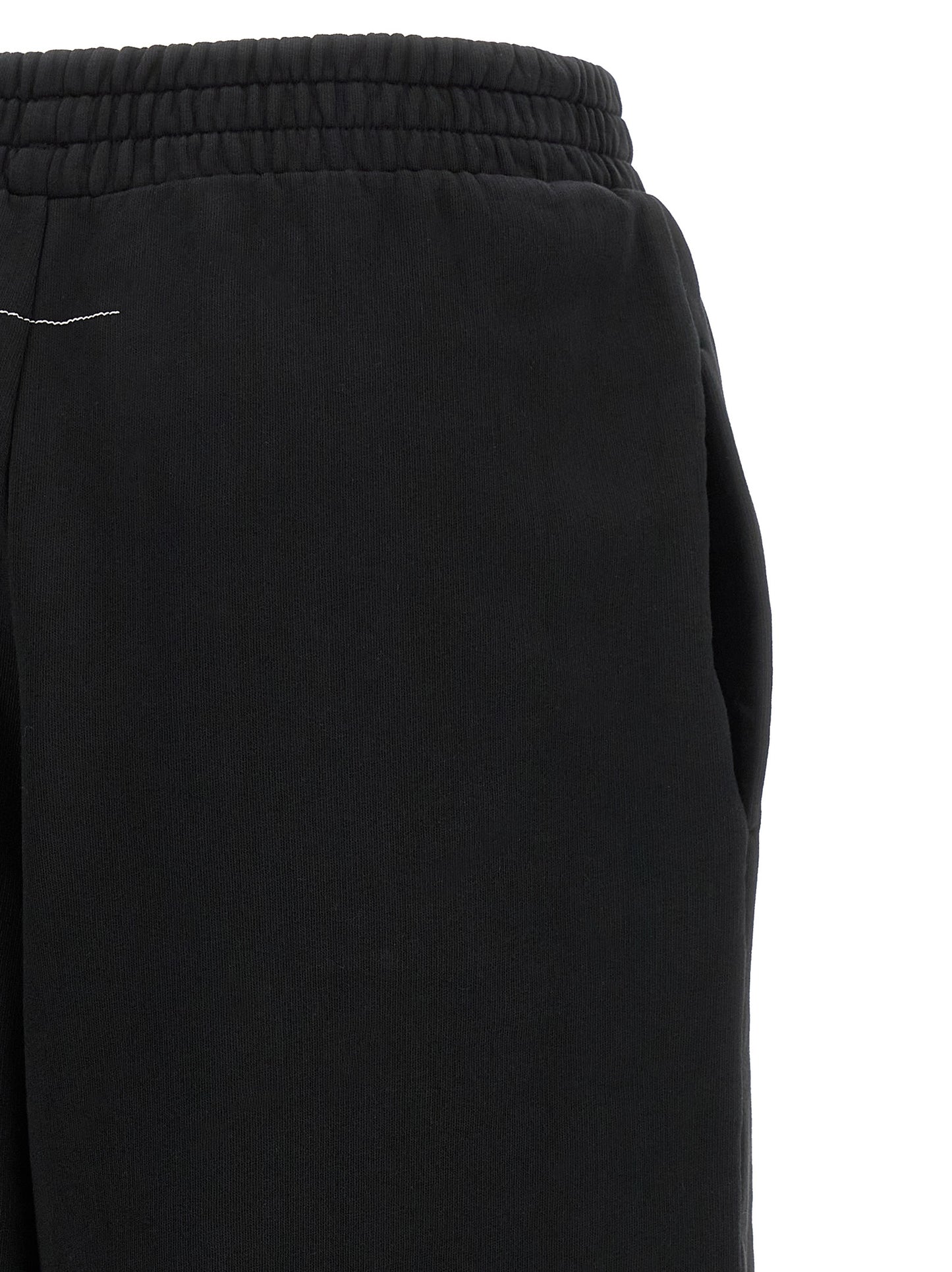 Joggers by MM6 Maison Margiela for women in cotton black, white & signature presents a tailored silhouette, showcasing a tailored athletic & relaxed-fit and long cut with a refined for a truly tailored aesthetic.