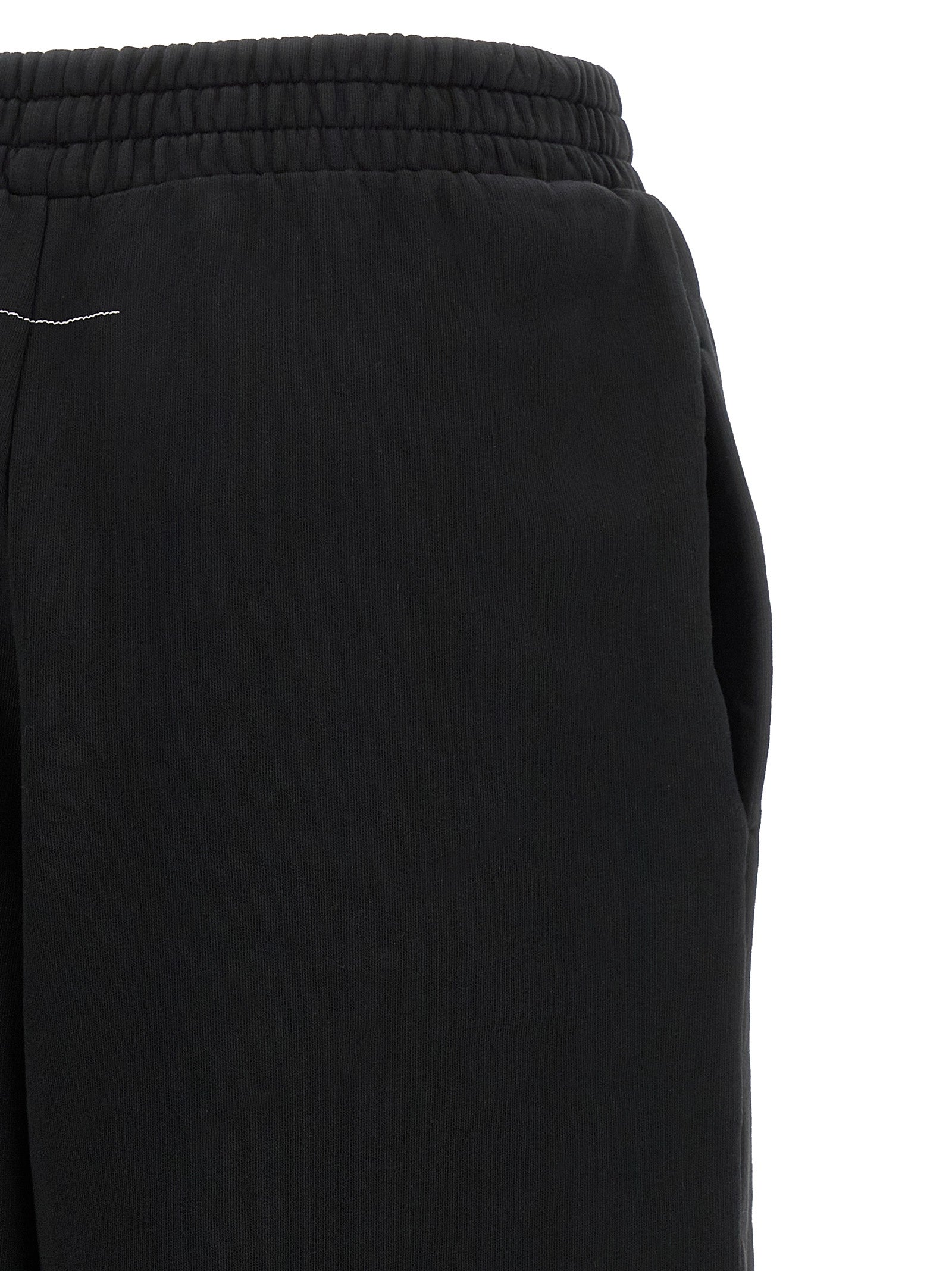 Joggers by MM6 Maison Margiela for women in cotton black, white & signature presents a tailored silhouette, showcasing a tailored athletic & relaxed-fit and long cut with a refined for a truly tailored aesthetic.