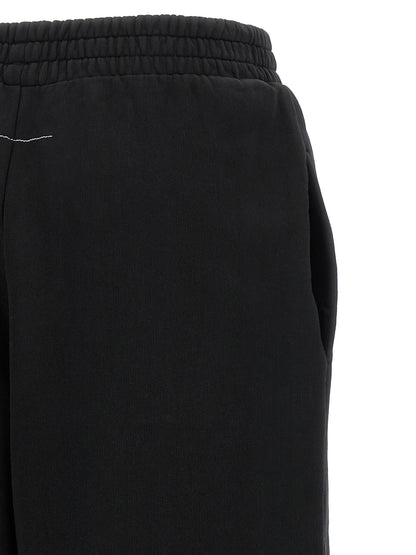 Joggers by MM6 Maison Margiela for women in cotton black, white & signature presents a tailored silhouette, showcasing a tailored athletic & relaxed-fit and long cut with a refined for a truly tailored aesthetic.