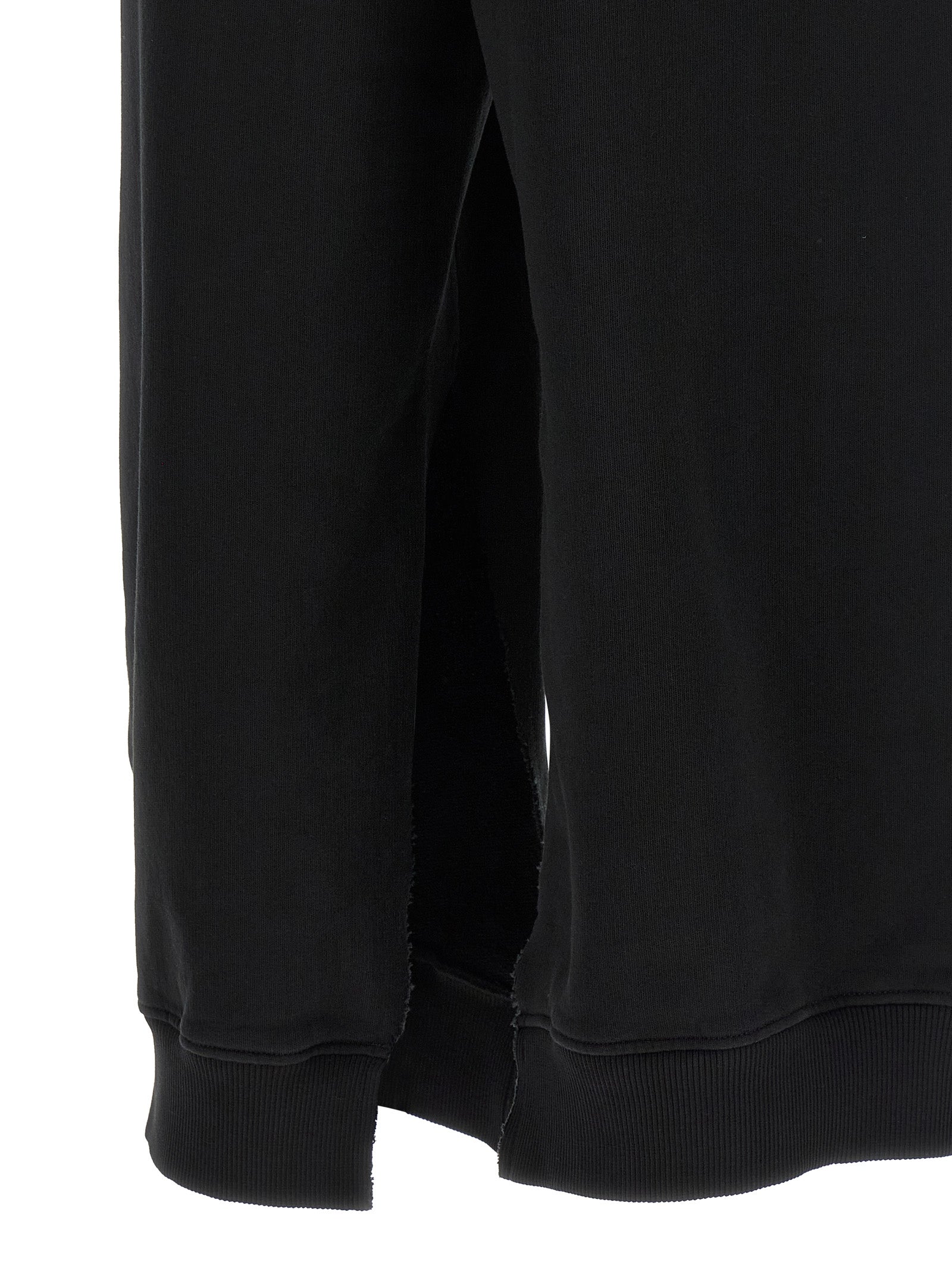 Joggers by MM6 Maison Margiela for women in cotton black, white & signature features an sophisticated and athletic & relaxed-fit with a precise long, creating a sophisticated and sophisticated silhouette.