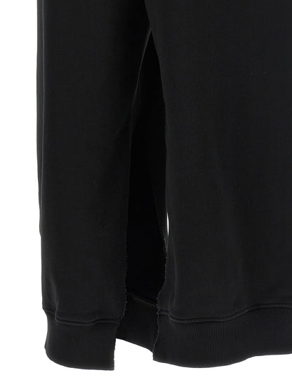 Joggers by MM6 Maison Margiela for women in cotton black, white & signature features an sophisticated and athletic & relaxed-fit with a precise long, creating a sophisticated and sophisticated silhouette.
