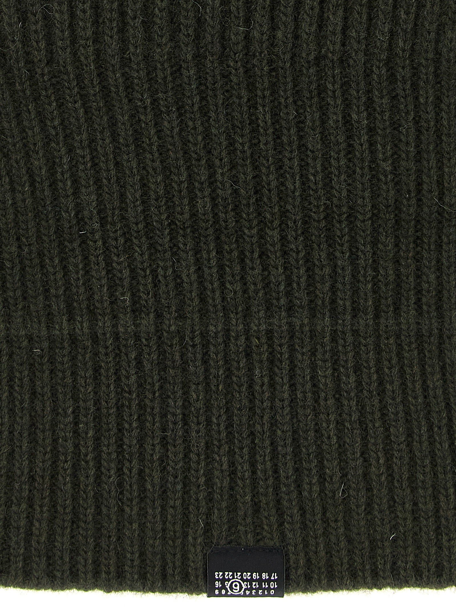 Hat by MM6 Maison Margiela for women in polyamide wool bicolour, black, green & signature showcases a delicate silhouette, artfully capturing the essence of the delicate Polyamide Wool Hat design for a sophisticated look.