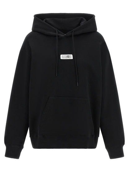 Sweatshirt Hoodie by MM6 Maison Margiela for women in cotton black, white & signature features a slouchy chic silhouette, detailed with a slouchy chic and a signature hooded neckline for an elevated aesthetic.