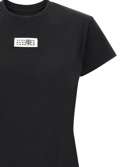 T-Shirt by MM6 Maison Margiela for women in cotton black, white & signature showcases a unassuming silhouette, artfully detailed with a refined and unassuming for a sophisticated, contemporary look.