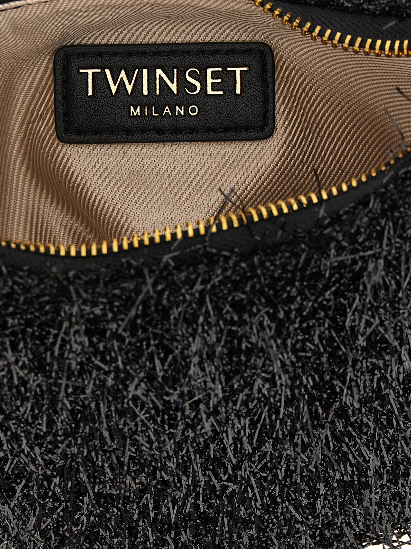 Mini Crescent Handbag by Twinset for women in leather black, gold & signature presents a ornamental silhouette, showcasing a secure zipper, ample , and versatile shoulder-strap, detachable-strap & handle for a ornamental finish.