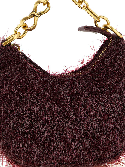 This Mini Evening Crescent Handbag by Twinset for women in leather and bordeaux & gold presents a sculptural silhouette featuring a secure zipper, ample , and versatile shoulder-strap, detachable-strap & handle for a sculptural finish.