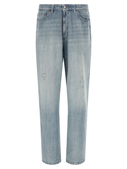 Jeans by MM6 Maison Margiela for men in denim cotton light-blue, white & signature presents a refined pantology silhouette, artfully defined by a refined pantology straight-leg & relaxed-fit, long, and a sophisticated .