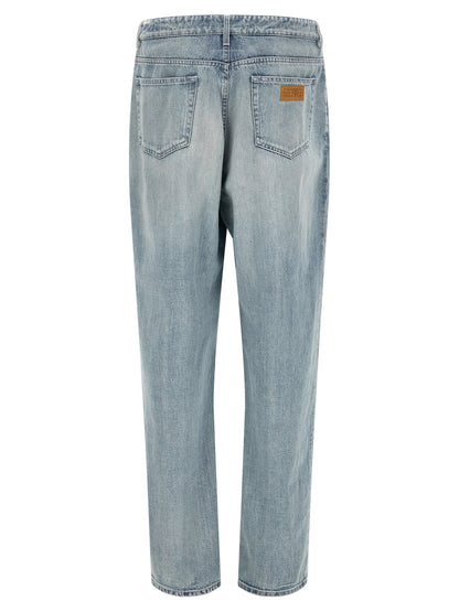 Jeans by MM6 Maison Margiela for men in denim cotton light-blue, white & signature features an sophisticated and straight-leg & relaxed-fit with a precise long, creating a sophisticated and sophisticated silhouette.