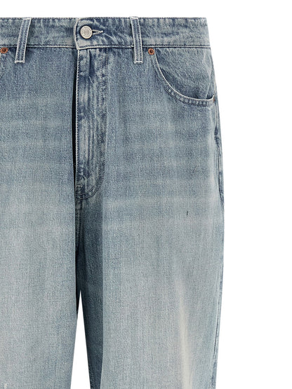 Jeans by MM6 Maison Margiela for men in denim cotton light-blue, white & signature presents a tailored silhouette, showcasing a tailored straight-leg & relaxed-fit and long cut with a refined for a truly tailored aesthetic.