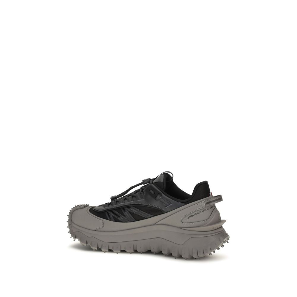 Athletic Sneakers by Moncler for men in bos taurus calf leather gray & signature showcases a architectural silhouette, artfully capturing the essence of the Men's Athletic Bos Taurus Calf Leather Sneakers with its signature architectural athletic style construction.