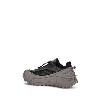 Athletic Sneakers by Moncler for men in bos taurus calf leather gray & signature showcases a architectural silhouette, artfully capturing the essence of the Men's Athletic Bos Taurus Calf Leather Sneakers with its signature architectural athletic style construction.