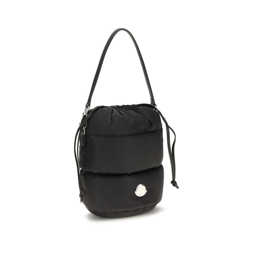 Bucket Handbag by Moncler for women in nylon leather black & signature features an effortlessly chic silhouette, showcasing a secure drawstring, effortlessly chic , and versatile shoulder-strap & handle.