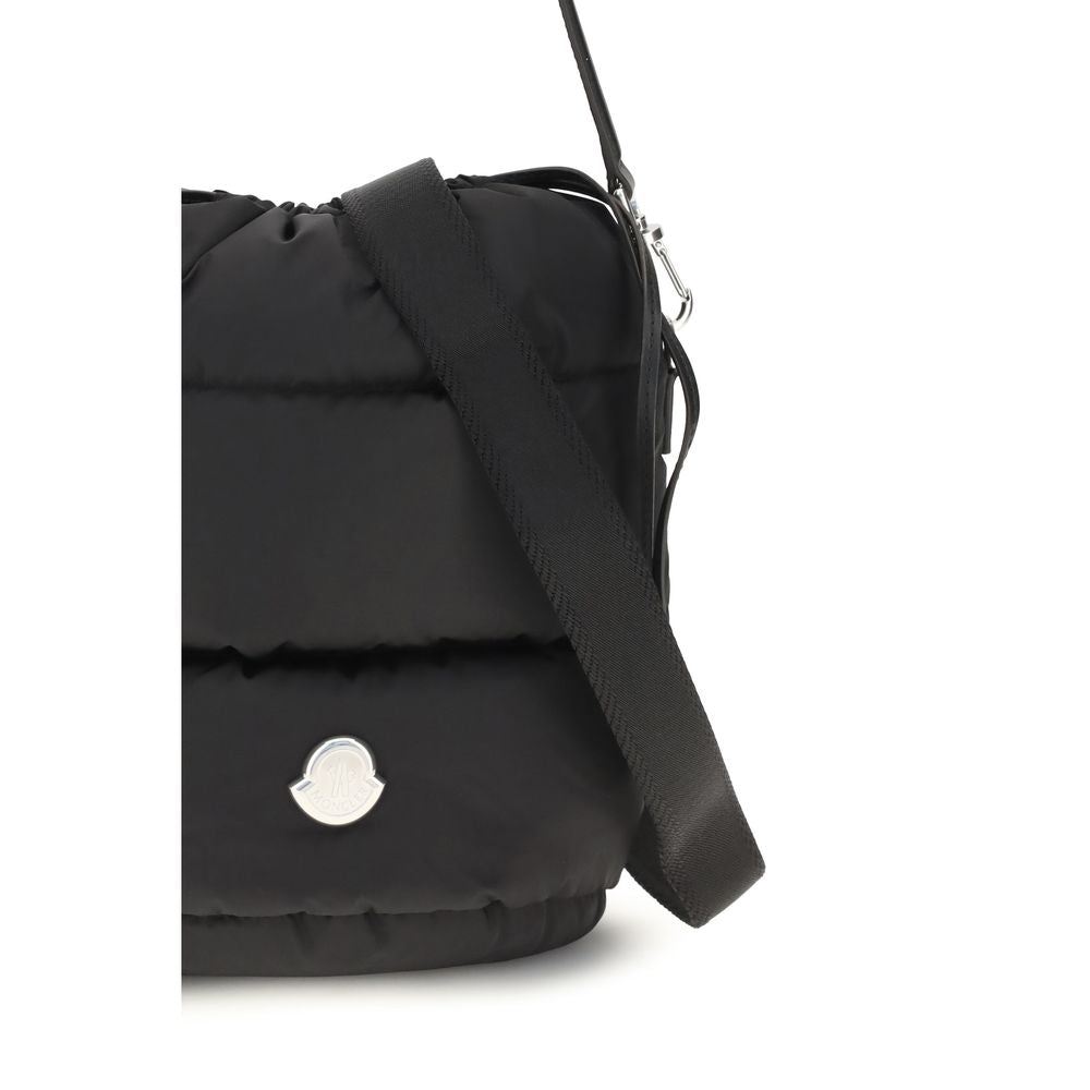 This Bucket Handbag by Moncler for women in nylon leather black & signature presents a effortlessly chic silhouette, featuring a secure drawstring, ample , and versatile shoulder-strap & handle for a effortlessly chic finish.