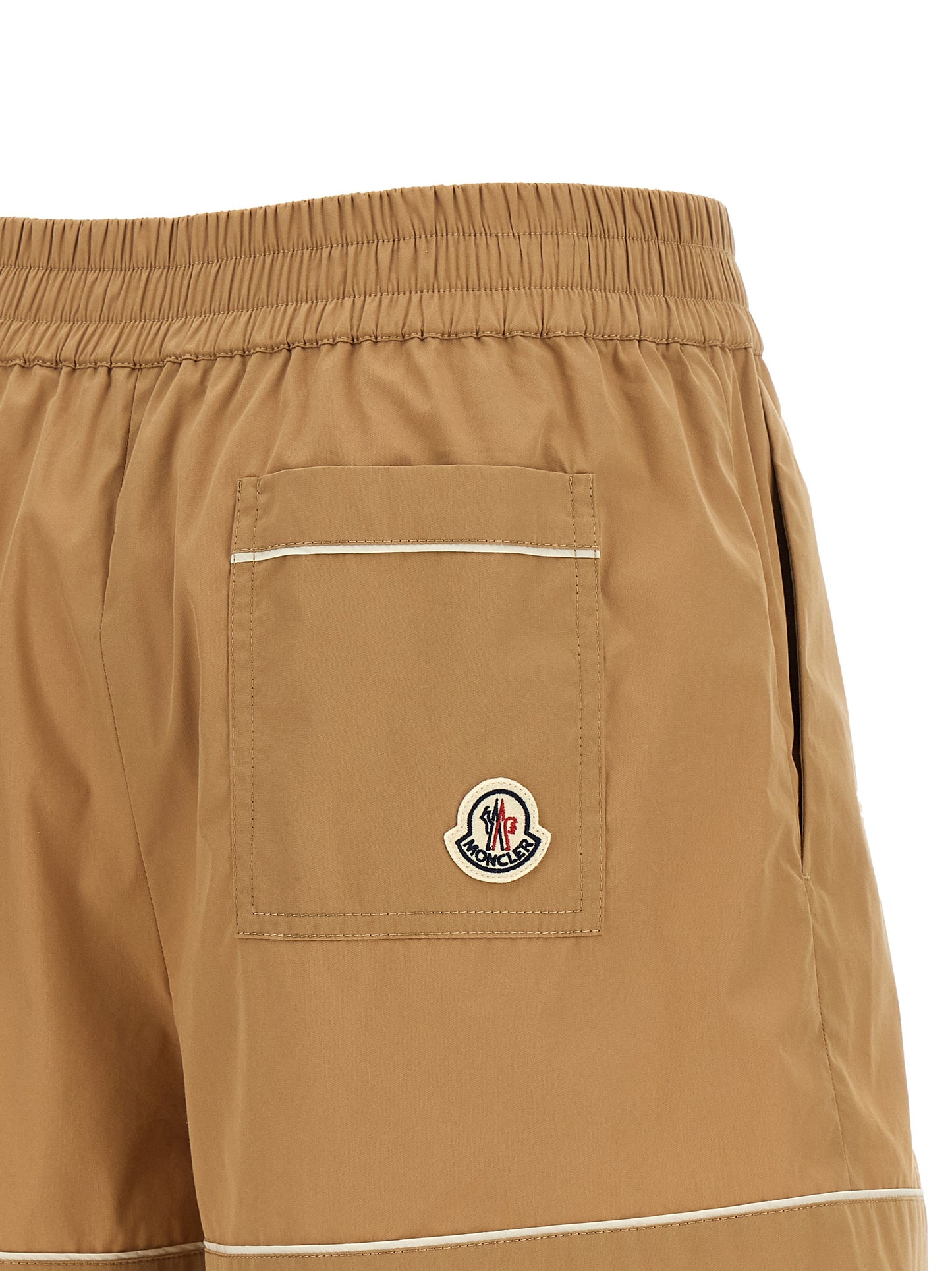 Bermuda Shorts by Moncler for women in cotton & nylon beige features a sartorial silhouette, showcasing a sartorial flared and short with a sophisticated high rise for a sartorial look.