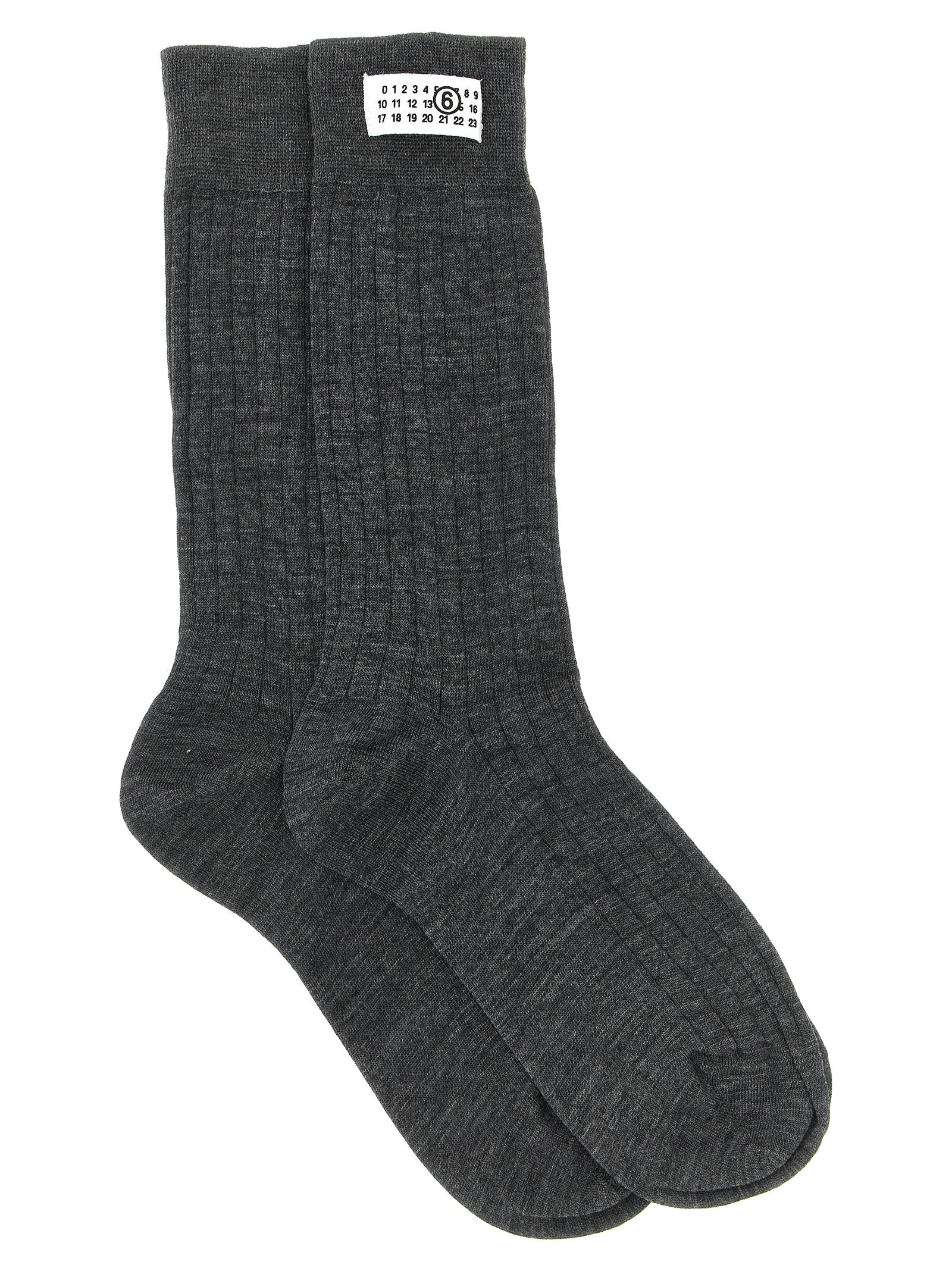 These Socks by MM6 Maison Margiela for women in polyamide calf leather & wool gray, white & signature present a utilitarian silhouette from the Women's Polyamide Calf Leather & Wool Socks collection, offering a utilitarian fit and refined aesthetic.