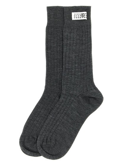Socks by MM6 Maison Margiela for women in polyamide calf leather & wool gray, white & signature features a snug silhouette, artfully capturing the essence of the snug Women's Polyamide Calf Leather & Wool Socks design for a sophisticated look.