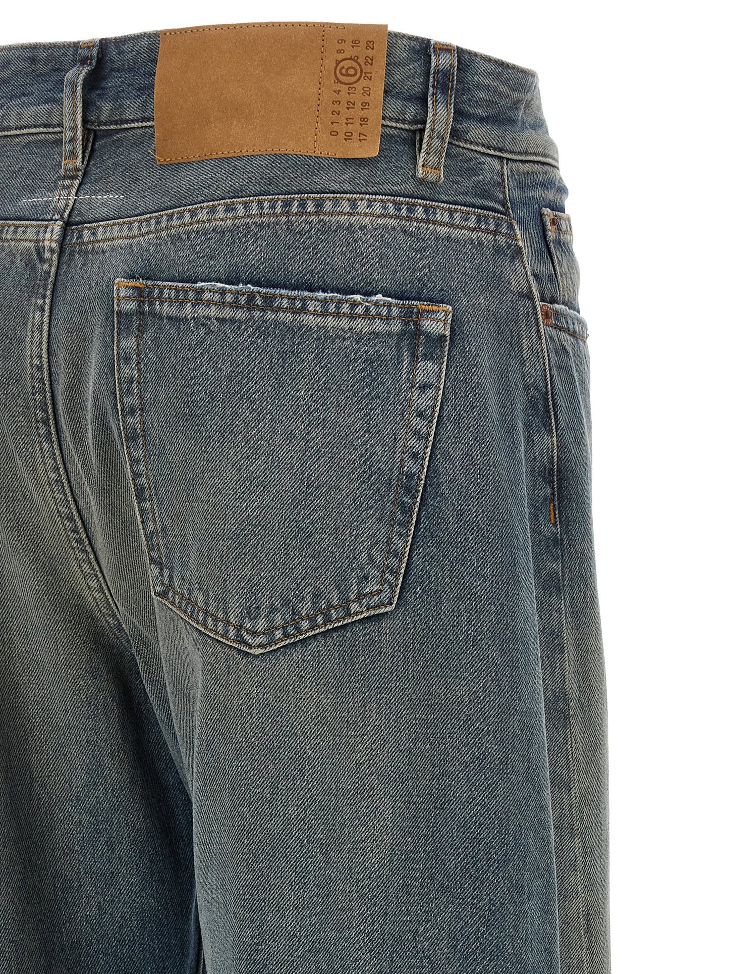 Jeans by MM6 Maison Margiela for women in cotton denim blue, white & signature features an sartorial wide and long with a high rise cut for a sartorial finish.