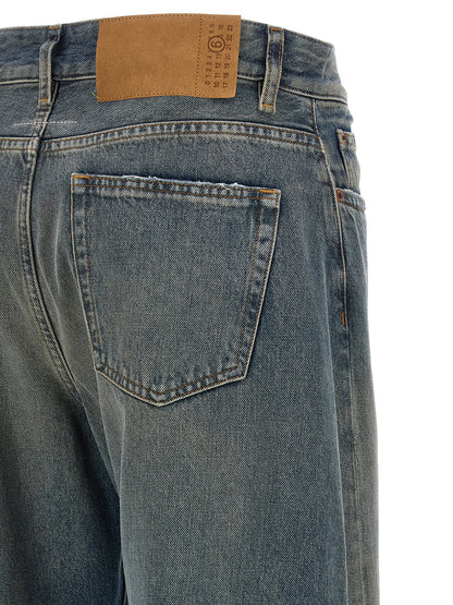 Jeans by MM6 Maison Margiela for women in cotton denim blue, white & signature features an sartorial wide and long with a high rise cut for a sartorial finish.