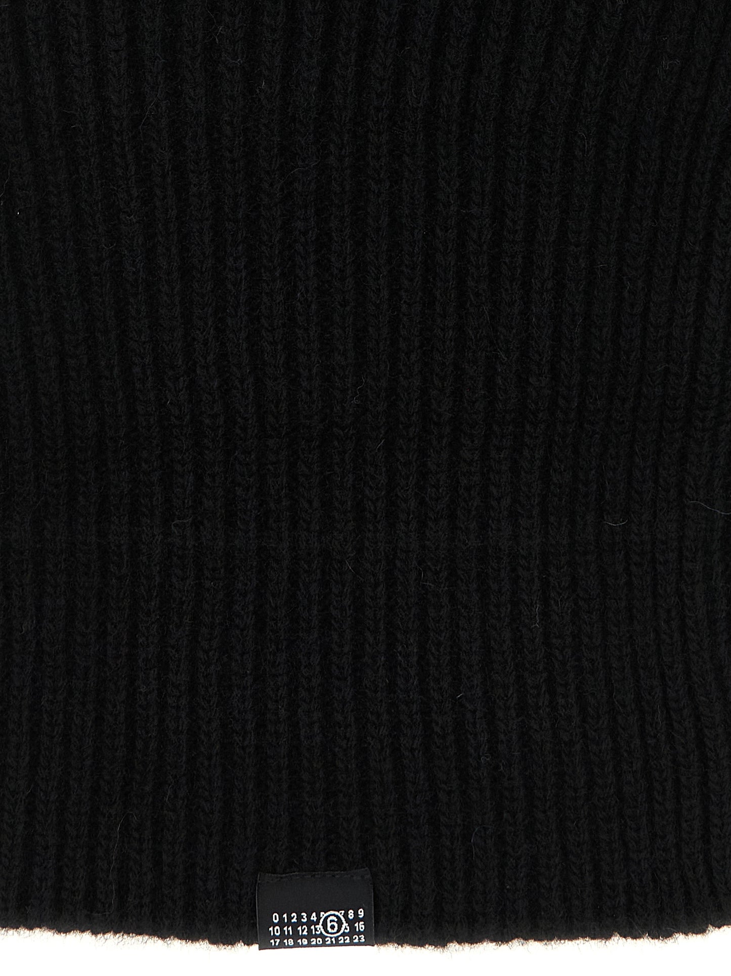 Balaclava by MM6 Maison Margiela for women in polyamide wool black & signature features a riviera-ready silhouette, artfully capturing the essence of the riviera-ready Polyamide Wool Balaclava design for a sophisticated look.