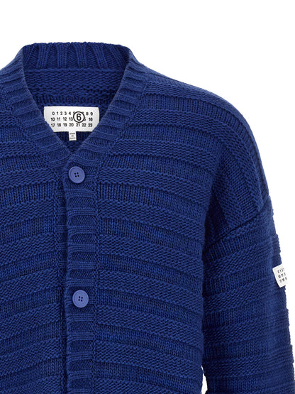 Cardigan by MM6 Maison Margiela for men in acrylic virgin wool blue & signature showcases a luxurious silhouette, meticulously detailed with a sophisticated v-neck neckline and for a refined finish.