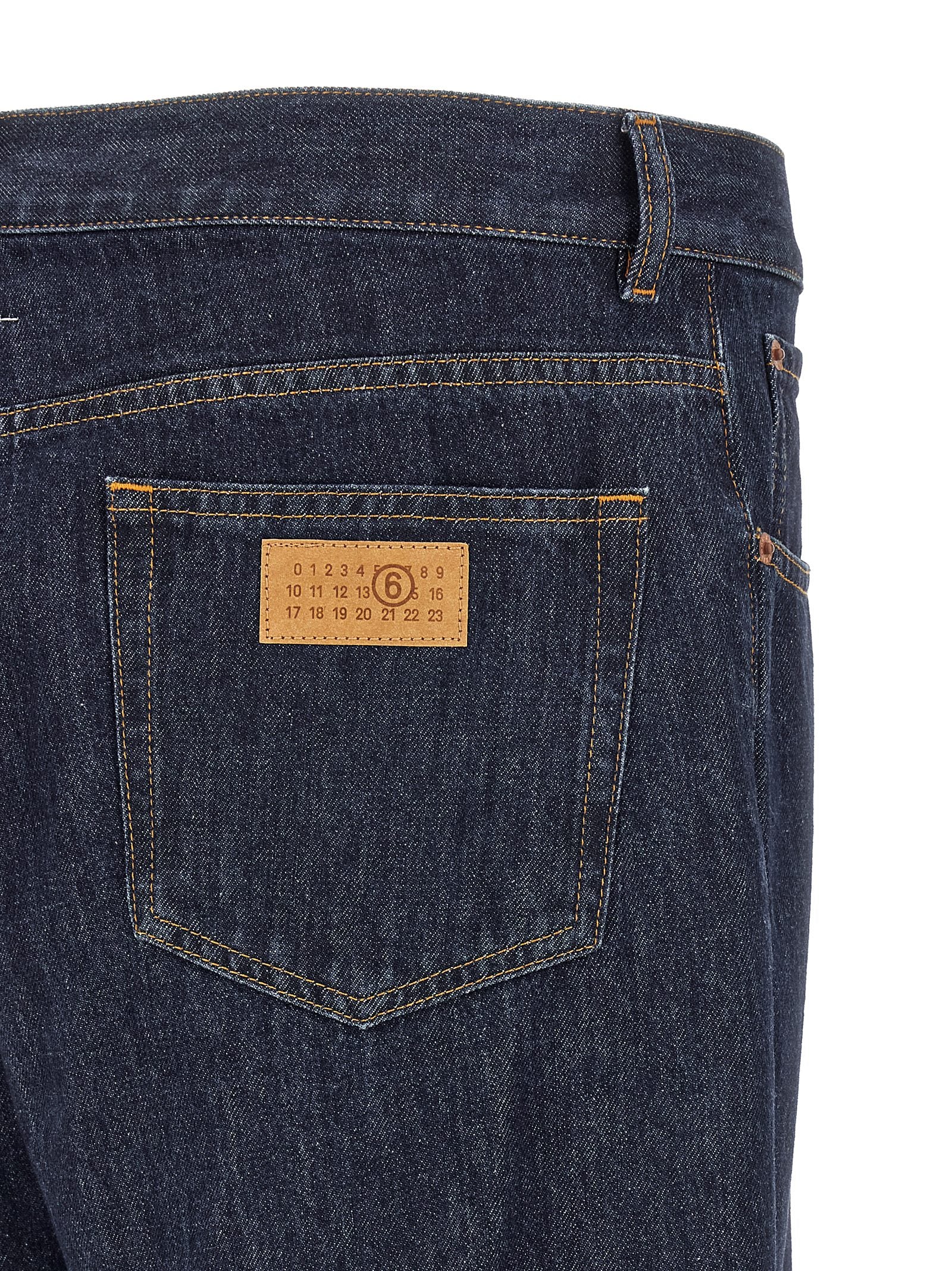 Jeans by MM6 Maison Margiela for men in denim cotton blue, orange, white & patchwork features a polished silhouette with a polished straight-leg, reaching a polished long and finished with a polished .