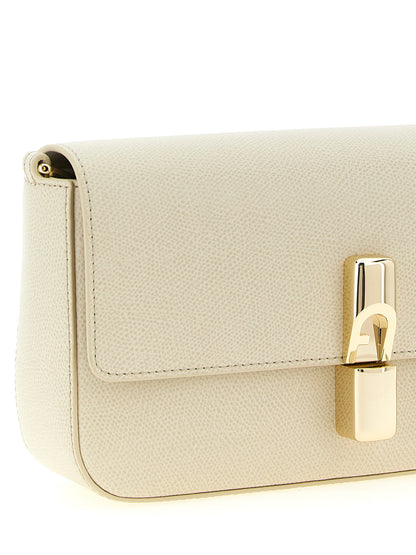 Compact Crossbody Handbag by Furla for women in bos taurus calfskin leather cream, gold & white showcases a versatile sophistication silhouette, featuring a secure snap & zipper, versatile sophistication , and versatile crossbody-strap, shoulder-strap & adjustable-strap for a versatile sophistication finish.