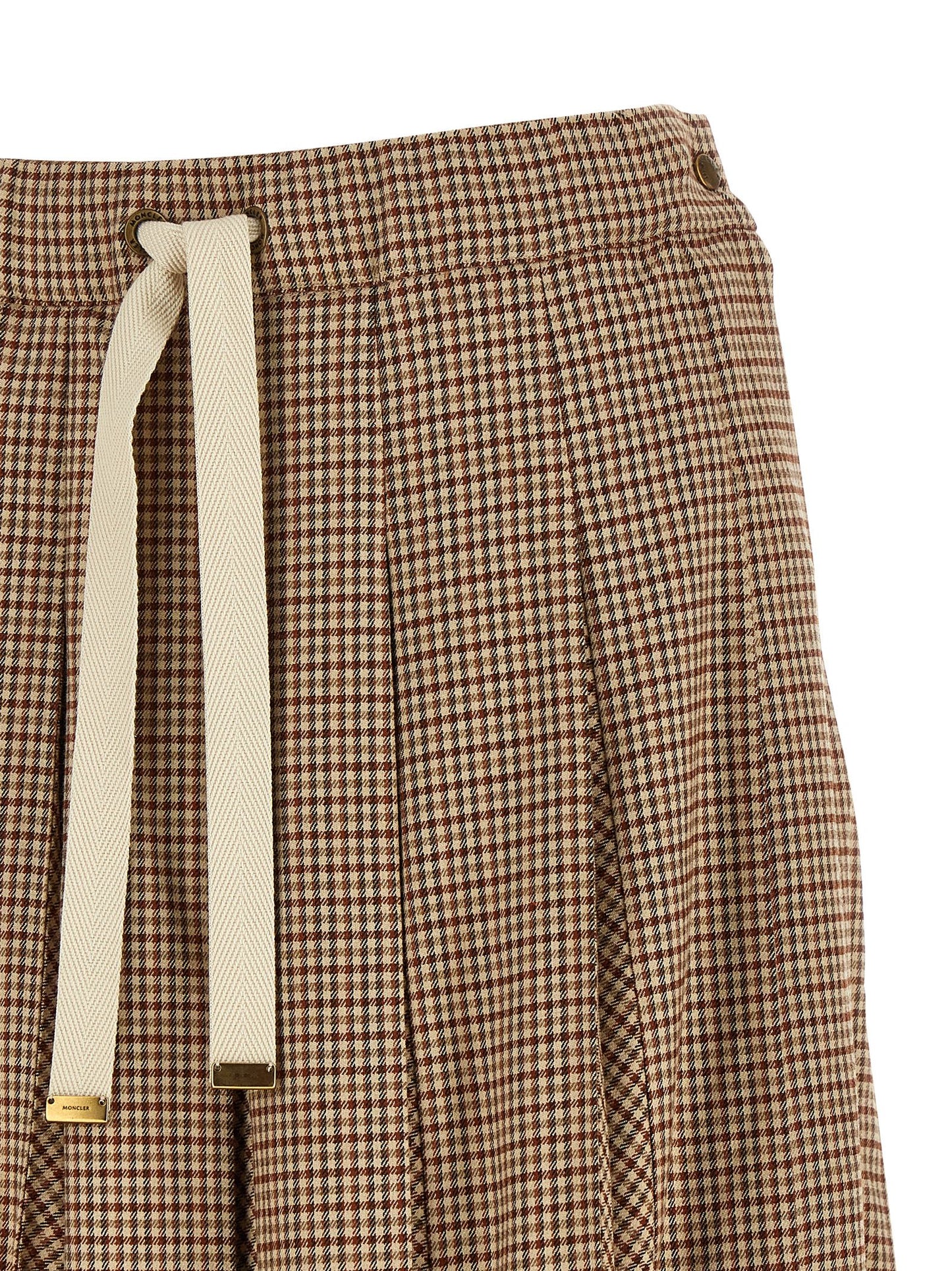 Skirt by Moncler for women in viscose & virgin wool beige, brown, gold & patterned features a contoured silhouette from the Ribbon Women's Pleated Viscose & Virgin Wool Midi Skirt collection, characterized by its contoured midi for a contoured finish.