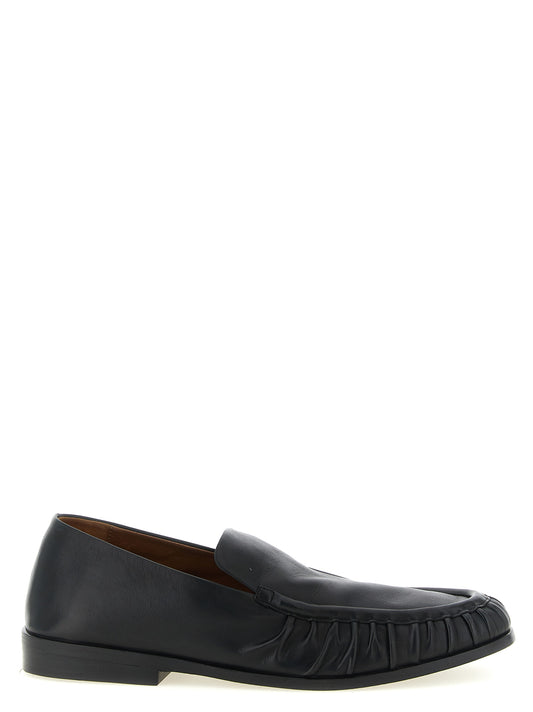 Flat Moccasin Moccasins Loafer Slip-On Shoes by Marsell for men in calfskin leather black & natural features an dynamic silhouette from the Men's Calfskin Leather Flat Moccasin Moccasins Loafer Slip-On Shoes collection, defined by a dynamic and flat for a dynamic look.