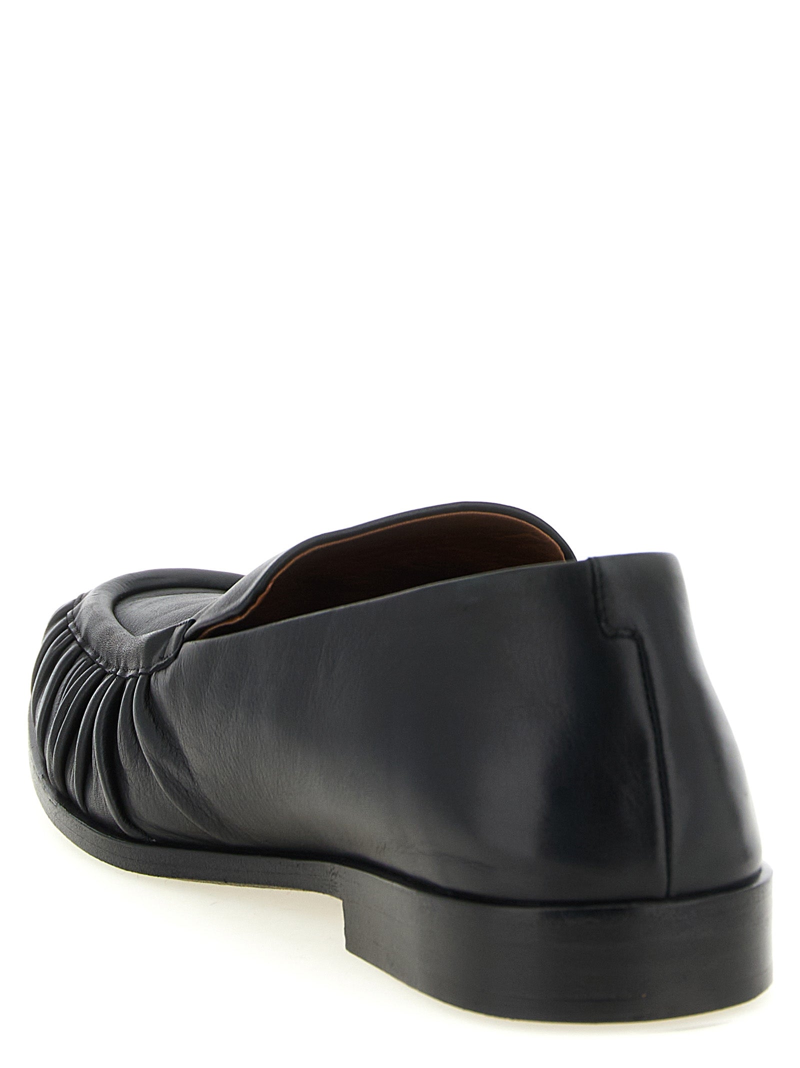 Flat Moccasin Moccasins Loafer Slip-On Shoes by Marsell for men in calfskin leather black & natural showcases a timeless silhouette from the Men's Calfskin Leather Flat Moccasin Moccasins Loafer Slip-On Shoes collection, featuring a timeless flat and for a timeless finish.