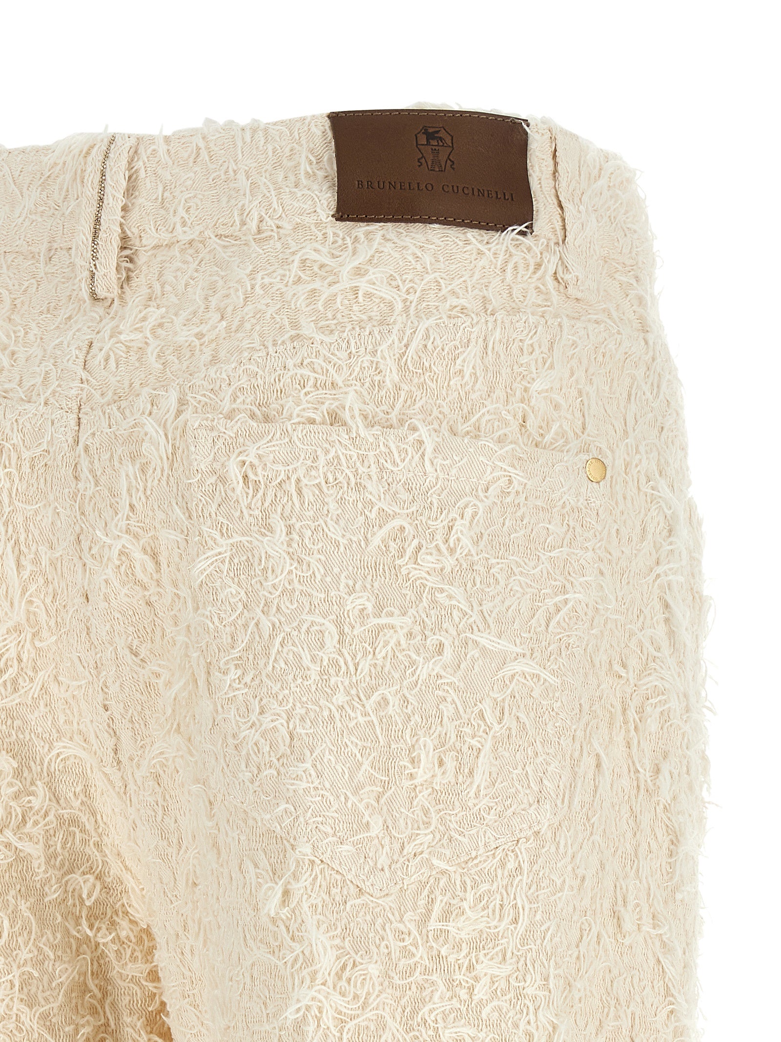 Trousers by Brunello Cucinelli for women in cotton denim beige, brown, gold & ivory presents a smart silhouette, meticulously detailed with a smart straight-leg & cropped, a smart cropped, and a smart high rise.