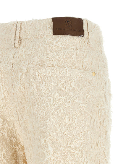 Trousers by Brunello Cucinelli for women in cotton denim beige, brown, gold & ivory presents a smart silhouette, meticulously detailed with a smart straight-leg & cropped, a smart cropped, and a smart high rise.