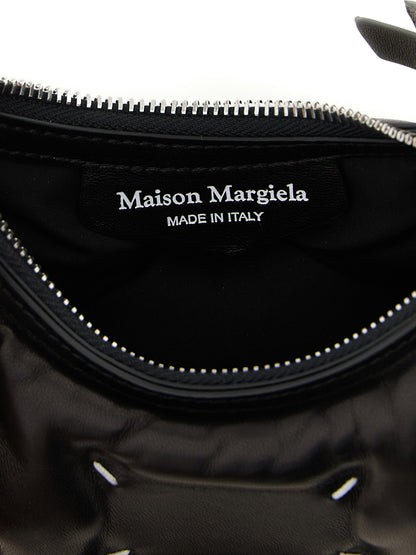 Micro Quilted 2-in-1 Shoulder & Crossbody Hobo Handbag by Maison Margiela for women in lamb leather black & silver features an versatile silhouette, showcasing a secure zipper and versatile with versatile crossbody-strap & shoulder-strap for a versatile finish.