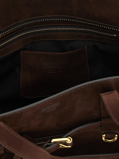 Handbag by Moschino for women in calfskin leather brown & gold features a signature silhouette, showcasing a secure zipper & buckle and signature with versatile shoulder-strap, handle & belt-strap for a sophisticated look.