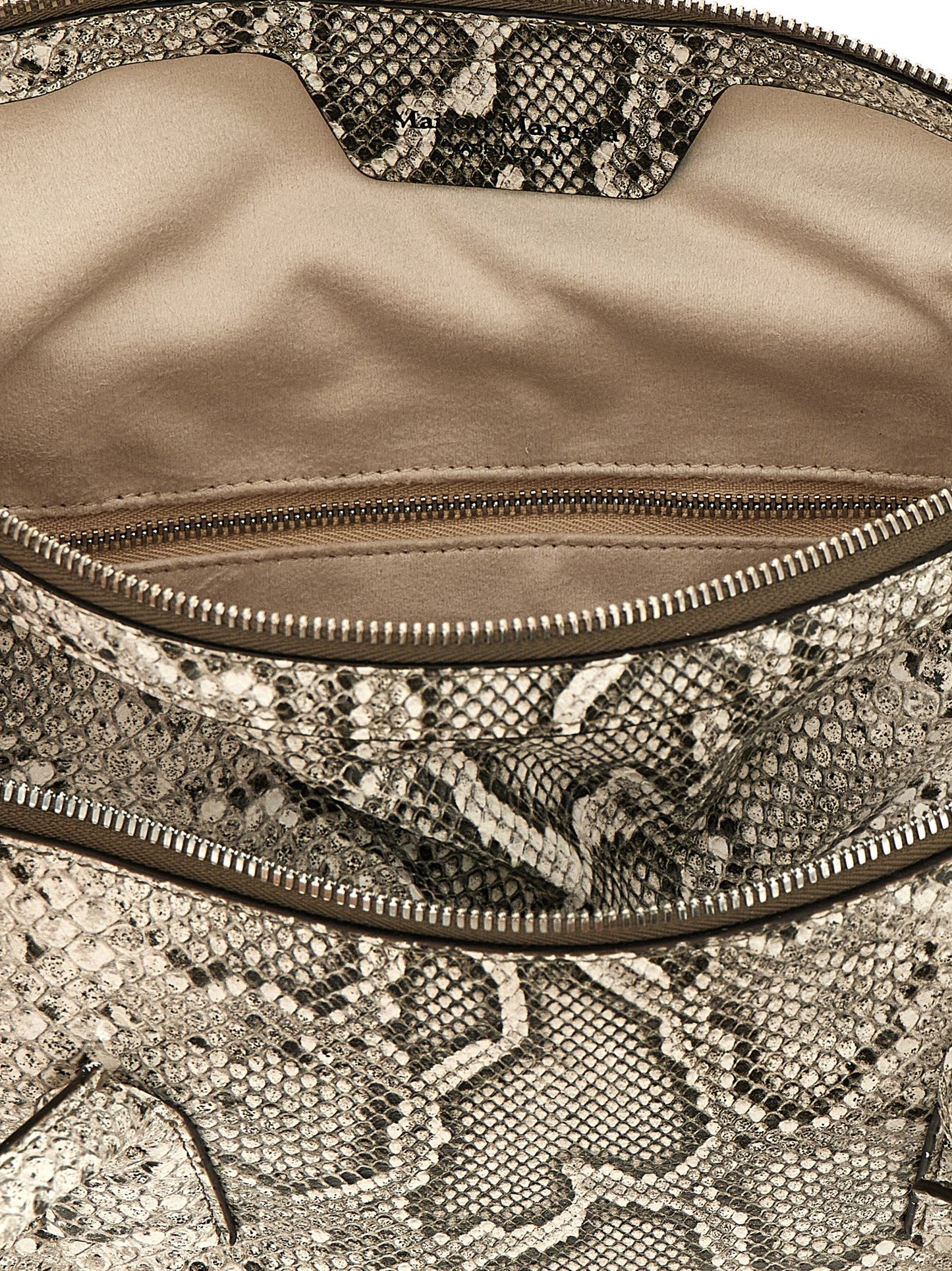 East West Shoulder Bag by Maison Margiela for women in viscose & synthetic fur silver & white features a effortless sophistication silhouette, secured by a zipper with ample and versatile shoulder-strap & handle for a effortless sophistication finish.
