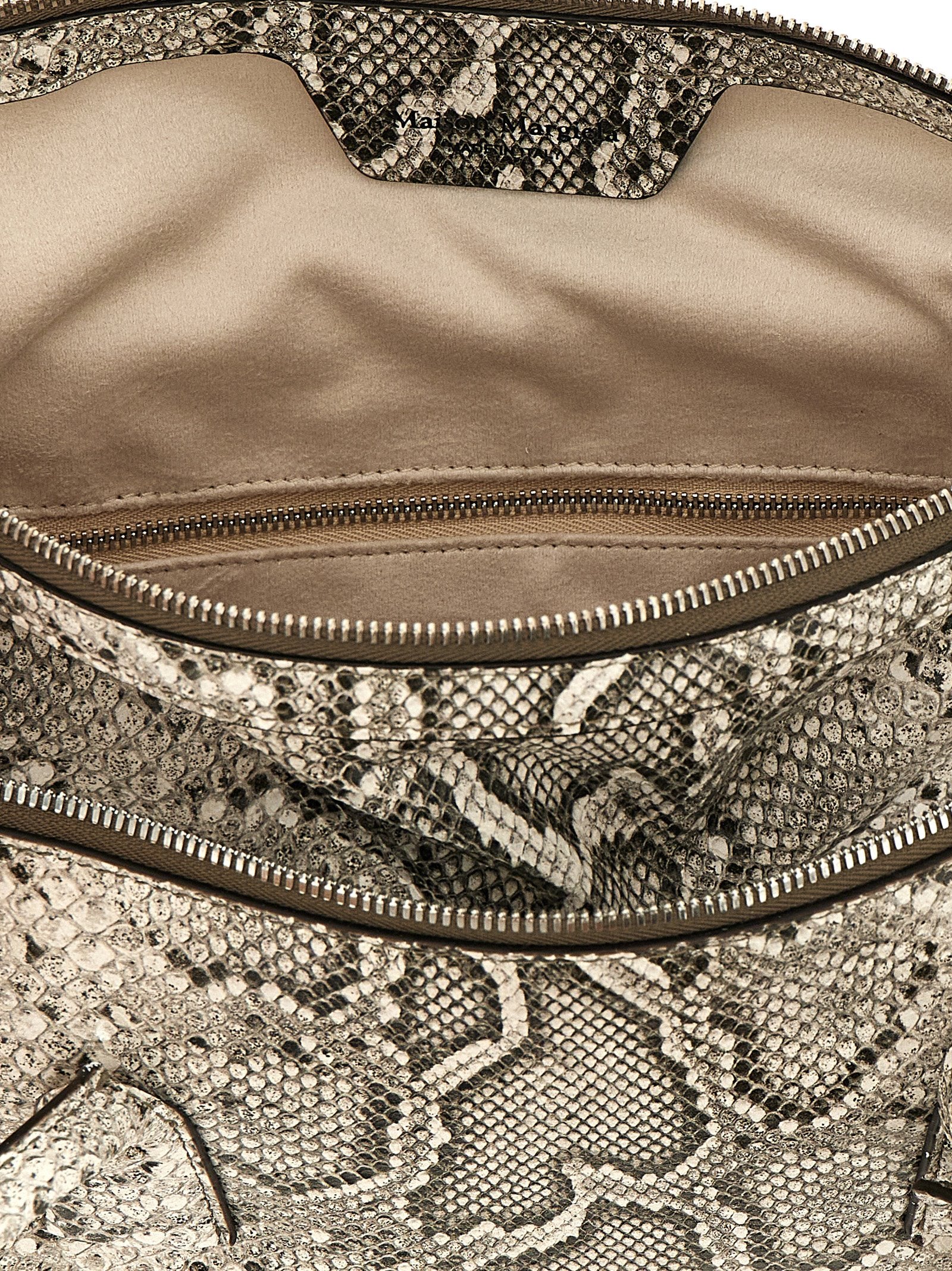 East West Shoulder Bag by Maison Margiela for women in viscose & synthetic fur silver & white features a effortless sophistication silhouette, secured by a zipper with ample and versatile shoulder-strap & handle for a effortless sophistication finish.