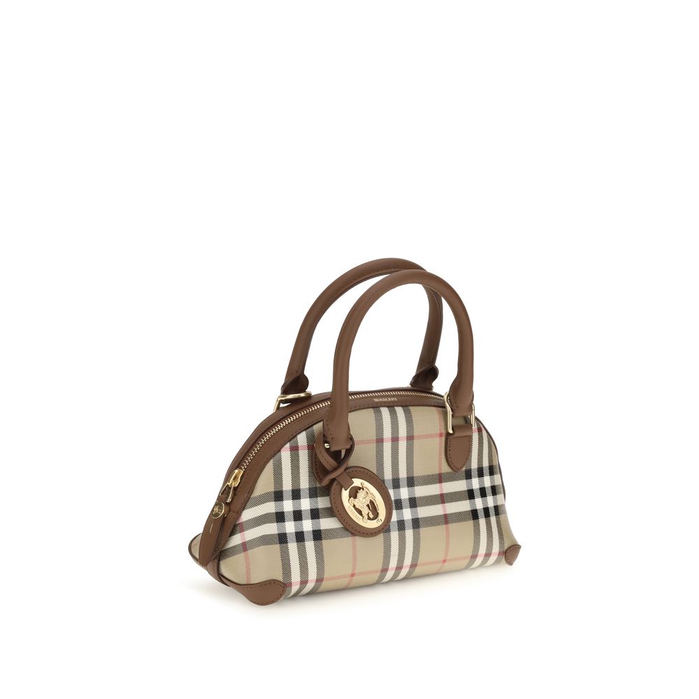 This Mini Handbag by Burberry for women in leather & canvas and beige, brown, gold, patterned & signature presents a sculptural silhouette featuring a secure zipper, ample , and versatile shoulder-strap, handle, adjustable-strap & detachable-strap for a sculptural finish.