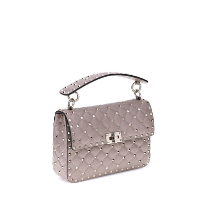 This Small Quilted Crossbody Flap Handbag by Valentino Garavani for women in nappa leather and multicolor & signature presents a sculptural silhouette featuring a secure flap, ample , and versatile crossbody-strap, adjustable-strap & handle for a sculptural finish.