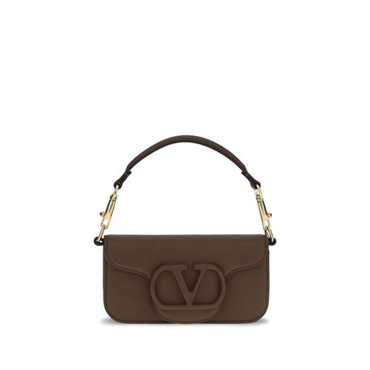 Mini 2-in-1 Shoulder & Crossbody Bag by Valentino Garavani for women in bos taurus calfskin leather brown, gold & signature features a enviable silhouette, showcasing a secure magnetic, ample , and enviable crossbody-strap, shoulder-strap, detachable-strap & handle for a enviable finish.