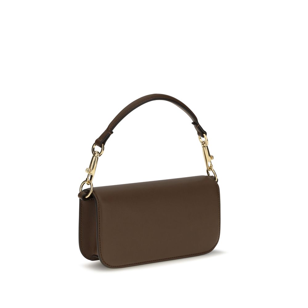 Mini 2-in-1 Shoulder & Crossbody Bag by Valentino Garavani for women in bos taurus calfskin leather brown, gold & signature showcases a enviable silhouette, artfully detailed with a secure magnetic, organized , and versatile crossbody-strap, shoulder-strap, detachable-strap & handle for a enviable look.