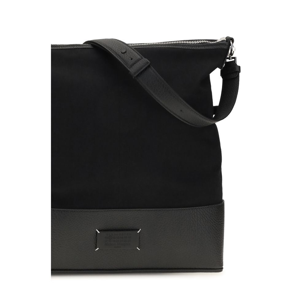 Medium Shoulder Hobo Bag by Maison Margiela for men in bos taurus calf leather black features a effortless sophistication silhouette, secured by a zipper with ample and versatile shoulder-strap & adjustable-strap for a effortless sophistication finish.