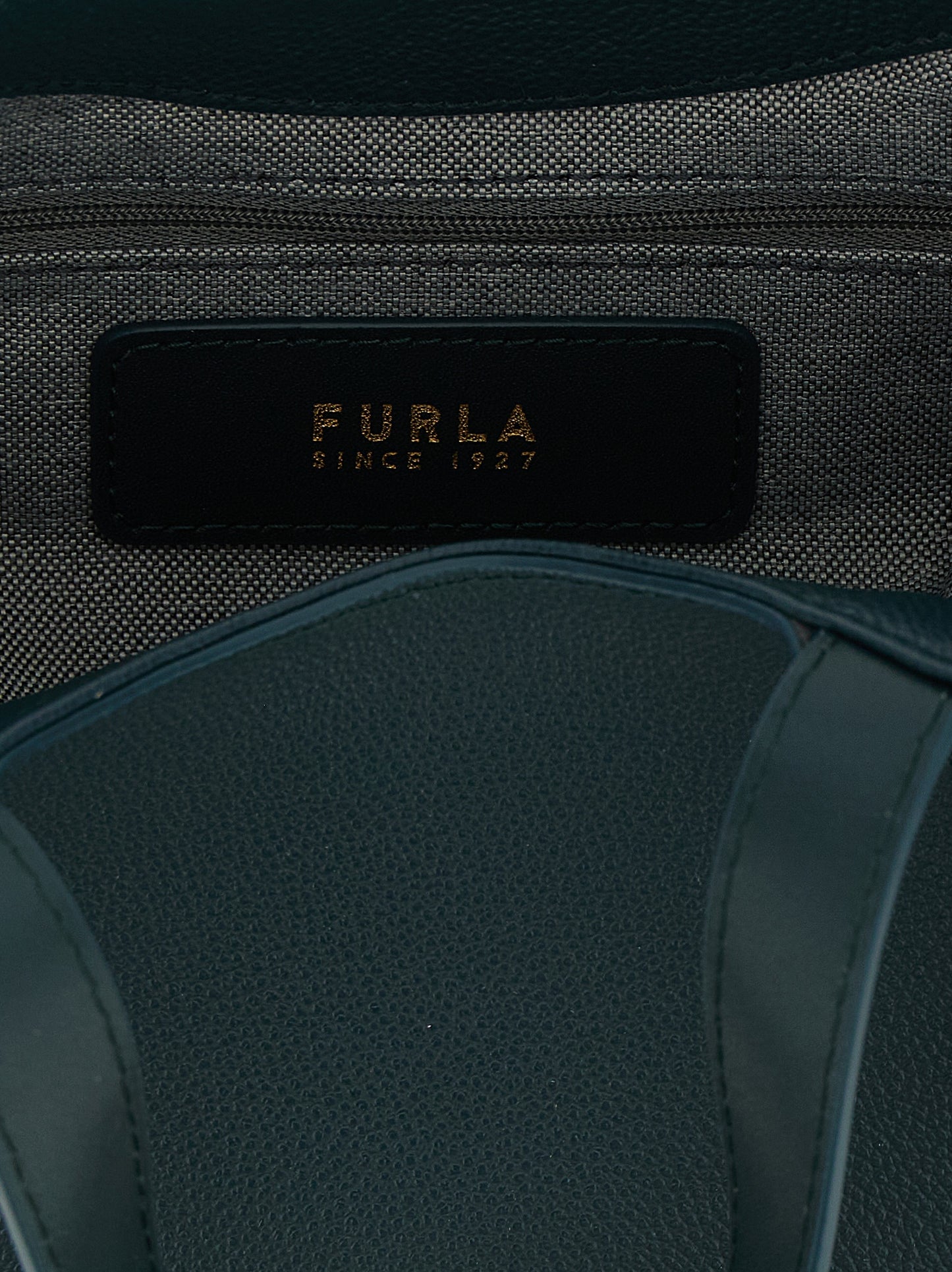 Tote Bag by Furla for women in calfskin leather & cotton bicolour, gold, green & teal features an jet-setting Goccia Calfskin Leather & Cotton Tote Bag design with a secure zipper, jet-setting , and versatile handle & adjustable-strap for a jet-setting look.