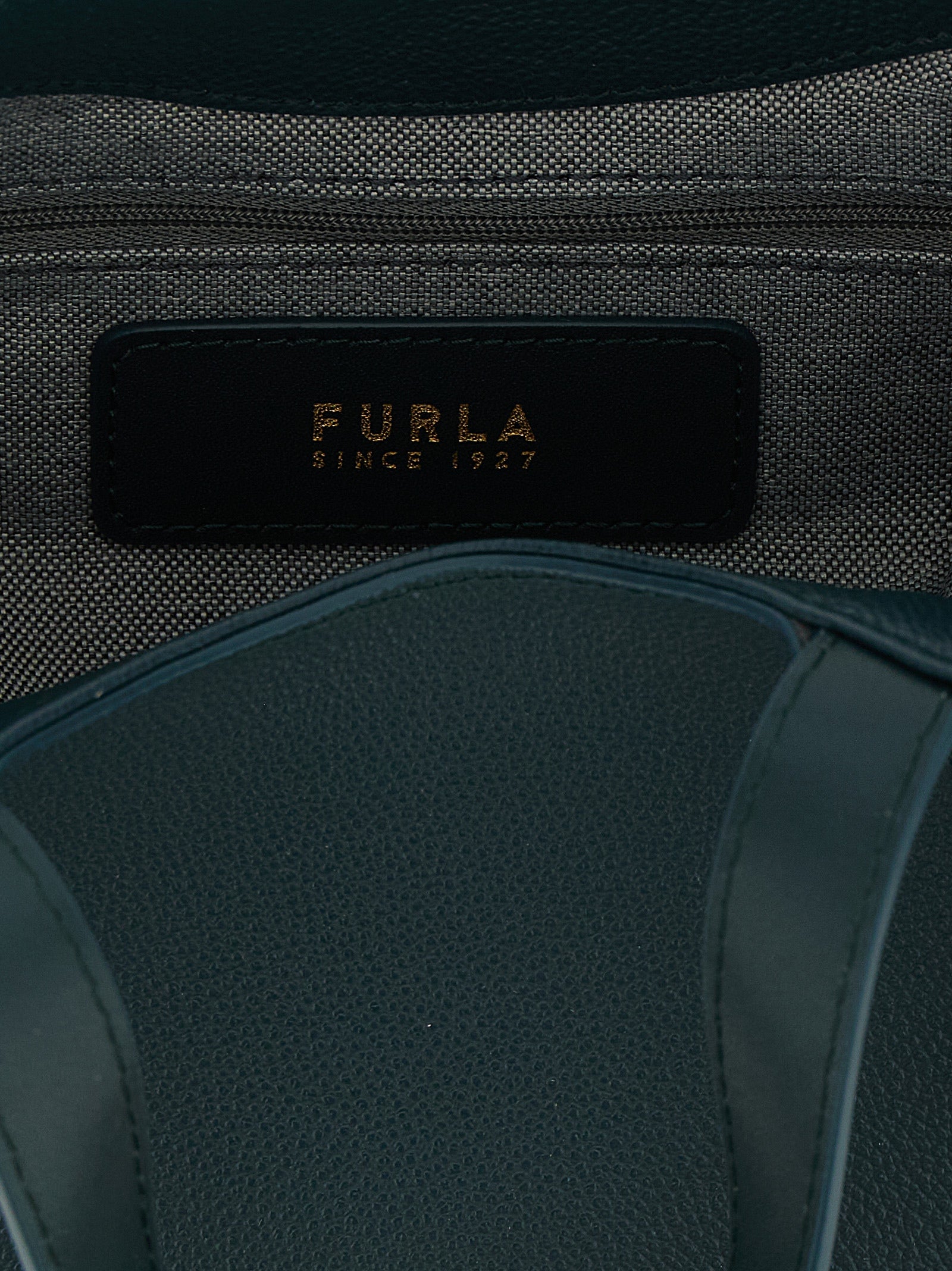 Tote Bag by Furla for women in calfskin leather & cotton bicolour, gold, green & teal features an jet-setting Goccia Calfskin Leather & Cotton Tote Bag design with a secure zipper, jet-setting , and versatile handle & adjustable-strap for a jet-setting look.
