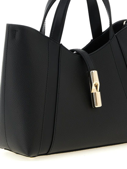This Tote Bag by Furla for women in calfskin leather black & gold features an jet-set Goccia Calfskin Leather Tote Bag design with a secure , ample , and jet-set shoulder-strap, handle & adjustable-strap.