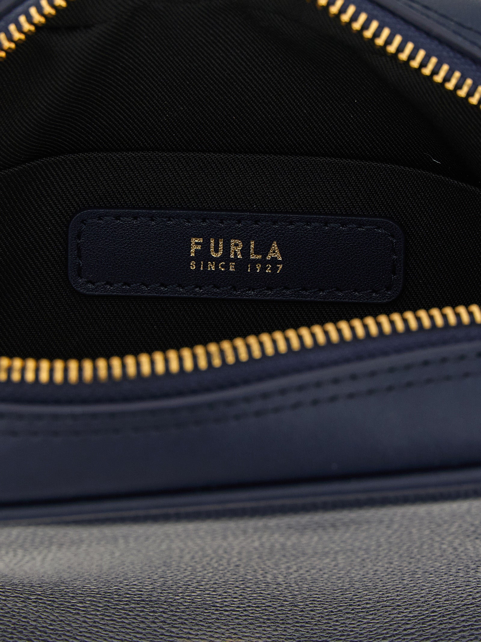 Dome Handbag by Furla for women in calfskin leather gold, navy & signature features a signature silhouette, showcasing a secure zipper and signature with versatile shoulder-strap & handle for a sophisticated look.