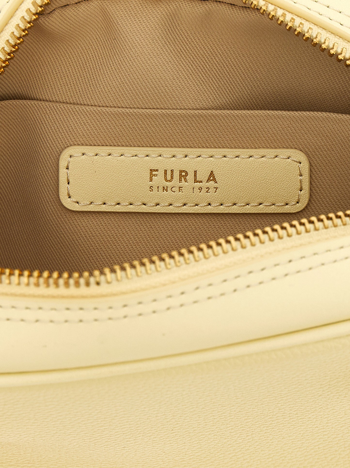 This Mini Handbag by Furla for women in calfskin leather and bicolour, gold & yellow presents a sculptural silhouette featuring a secure , ample , and versatile shoulder-strap & handle for a sculptural finish.